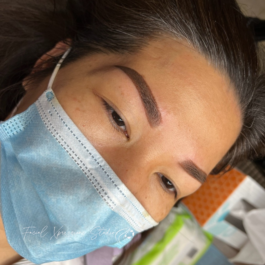 A close up of a woman wearing a face mask