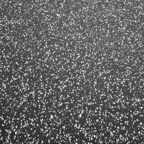 Close-up view of black rubber flooring speckled with small white and grey flecks, commonly used in gyms.