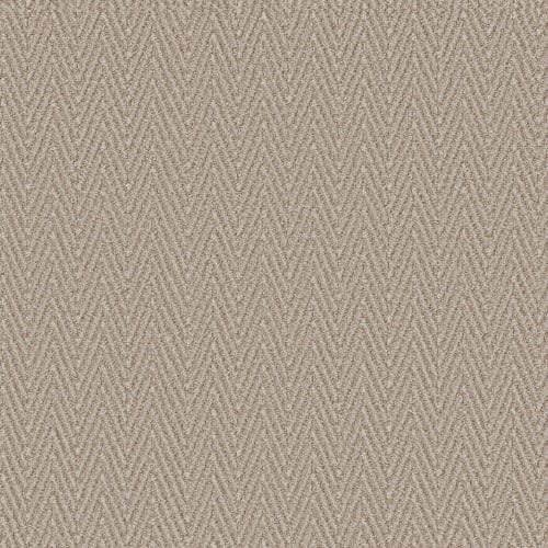 Close-up of a neutral beige fabric featuring a textured, woven herringbone pattern.