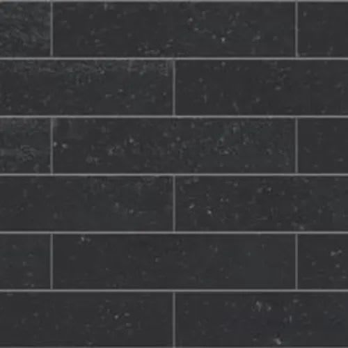 A repeating pattern of dark gray rectangular tiles arranged in a standard offset brick layout with thin gray grout lines.