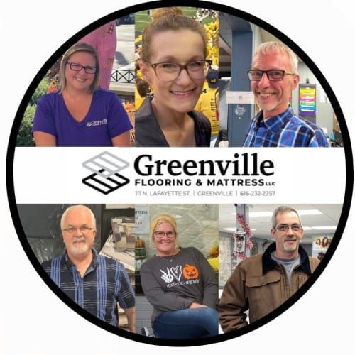 Circular company logo featuring six smiling employees above the Greenville Flooring & Mattress name, address, and phone.