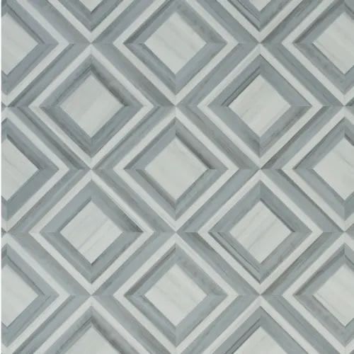 A geometric pattern of repeating diamonds in varying shades of gray and white, creating a three-dimensional effect.