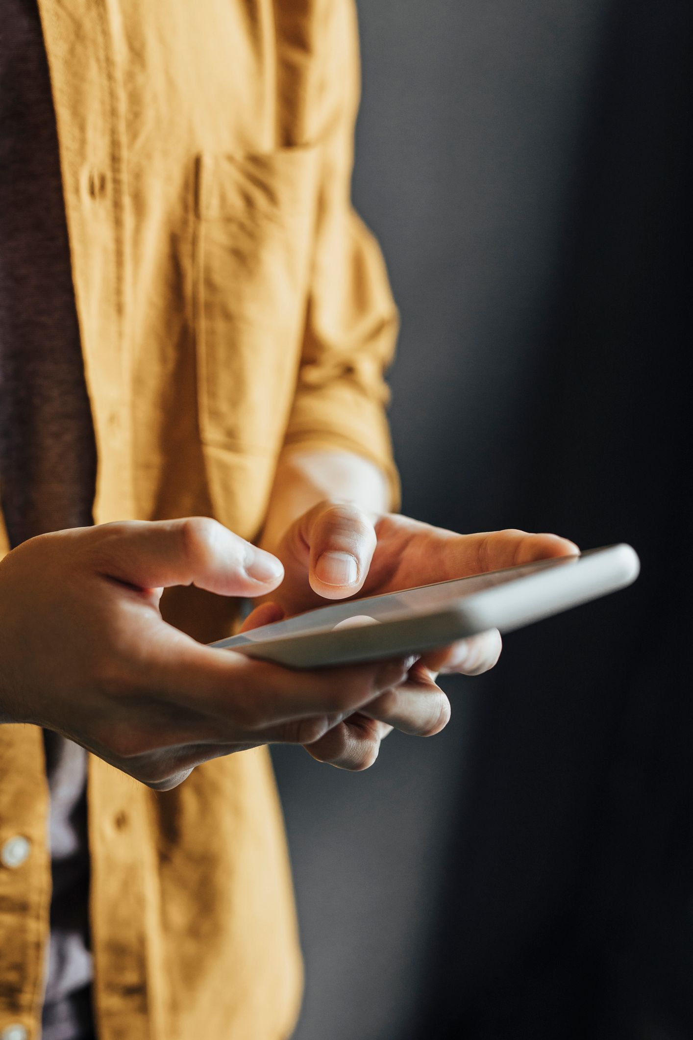 Photo of Person Texting - Click to Contact Us