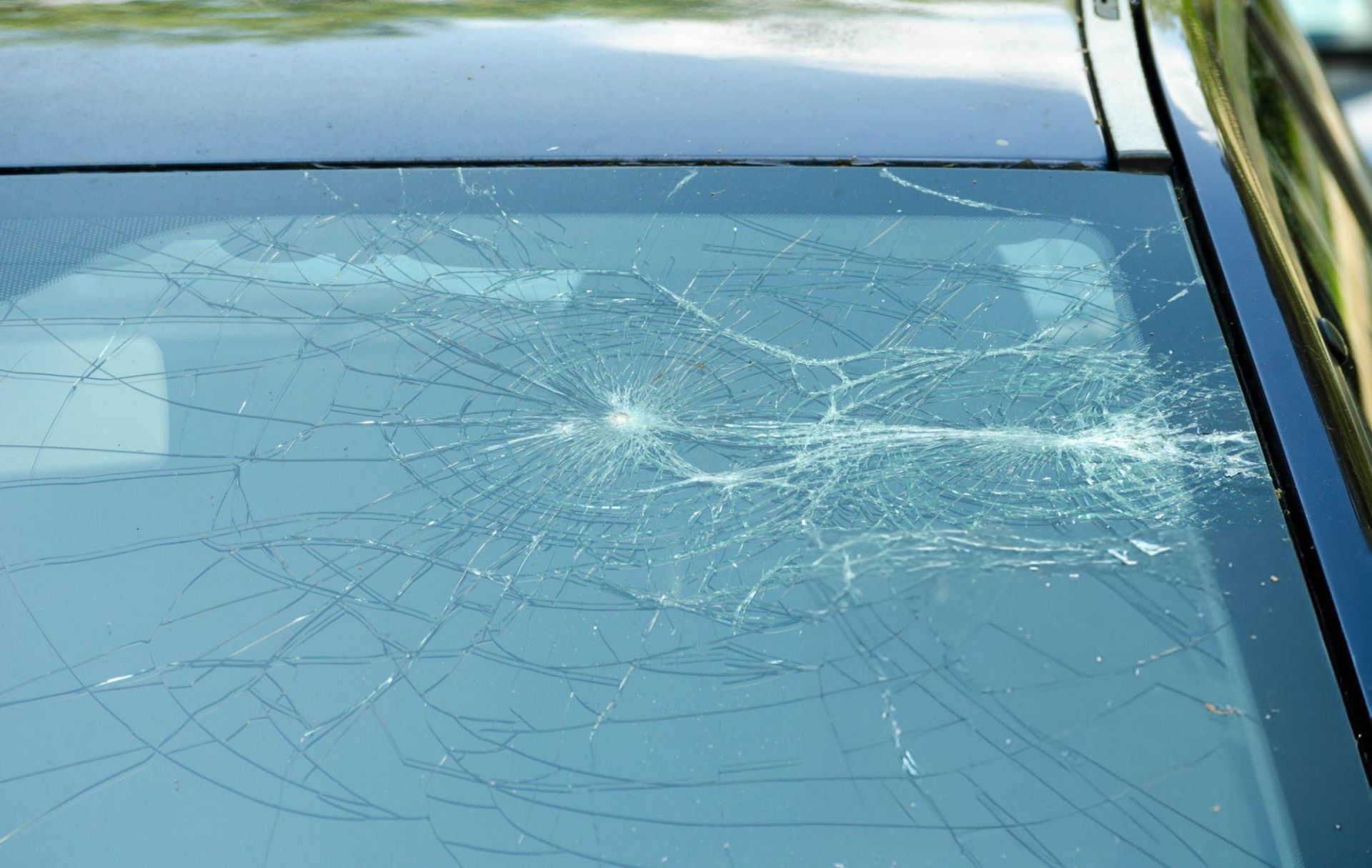 A car with a broken windshield A car with a broken windshield