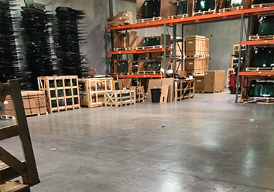 A warehouse filled with lots of boxes and shelves