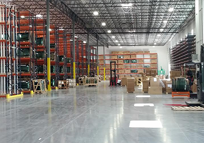 A large warehouse filled with lots of shelves and boxes