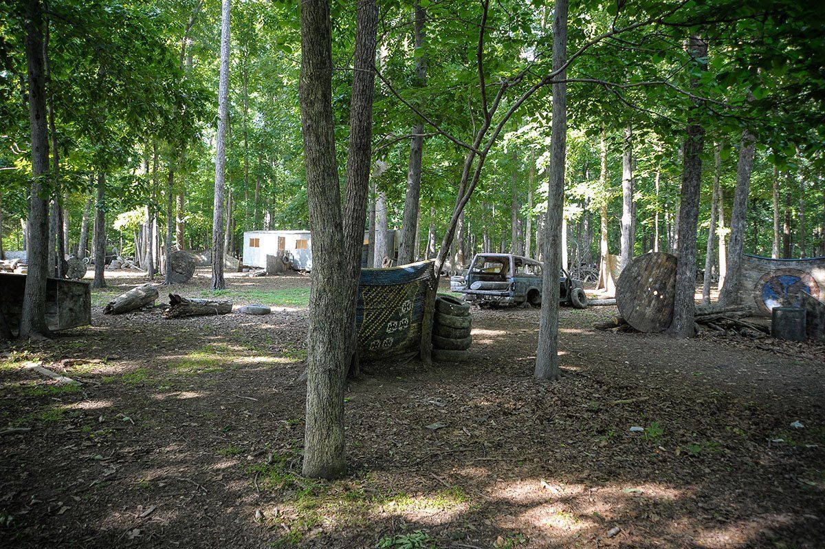 A paintball field in the middle of a forest.