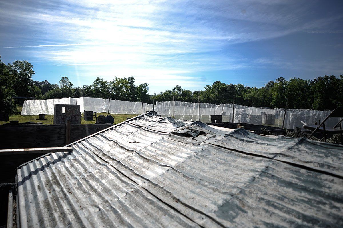 A roof of a building with a blue sky in the background.