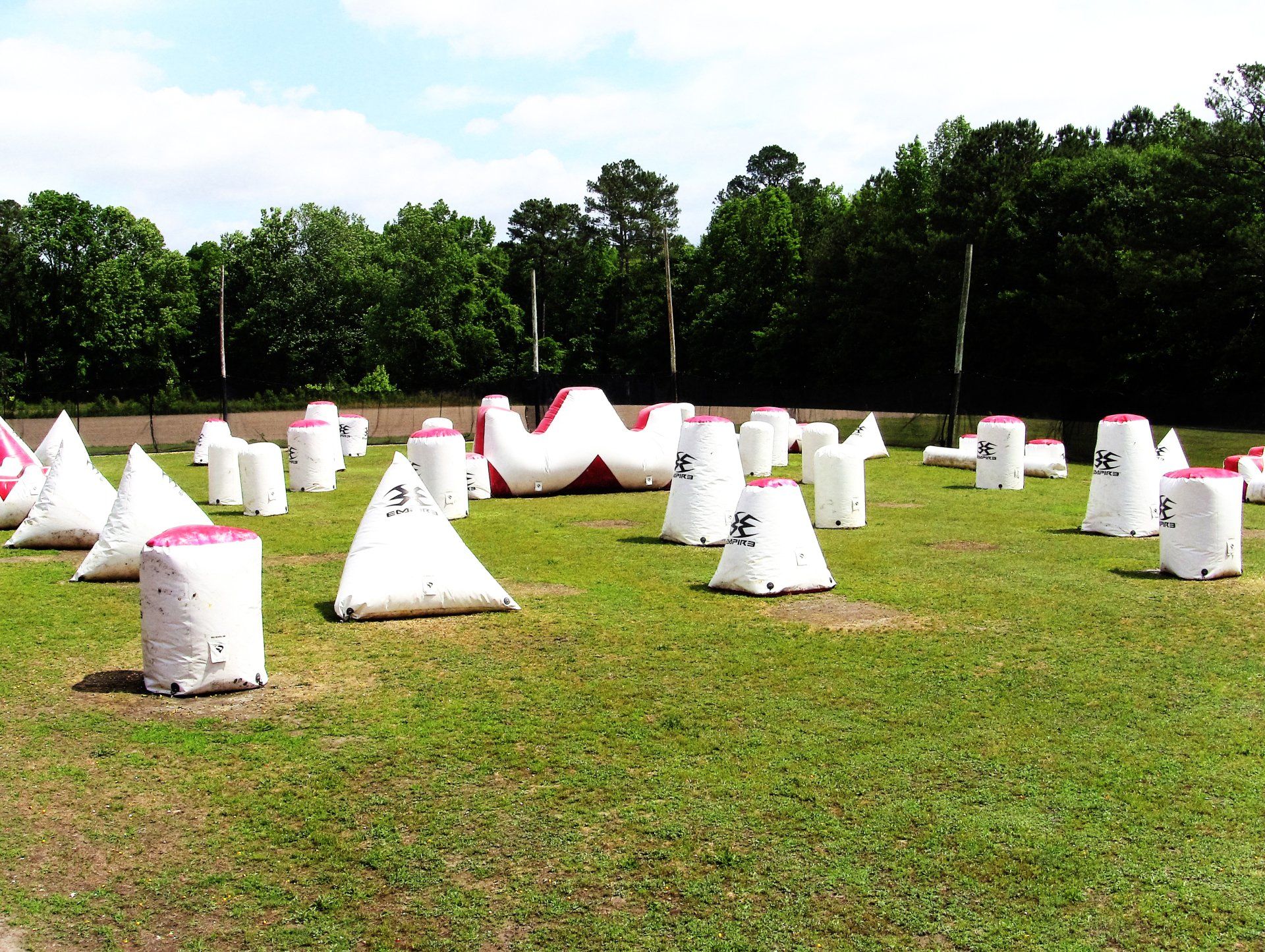 A paintball field with a lot of white bags in it