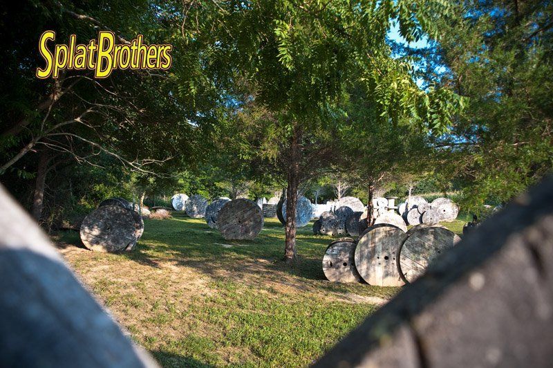 A paintball field with a sign that says splat brothers