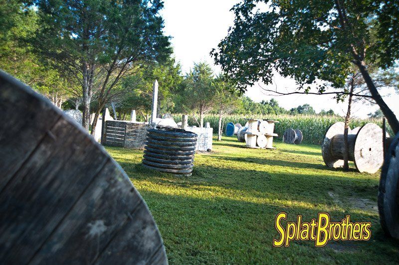A paintball field with a sign that says splat brothers
