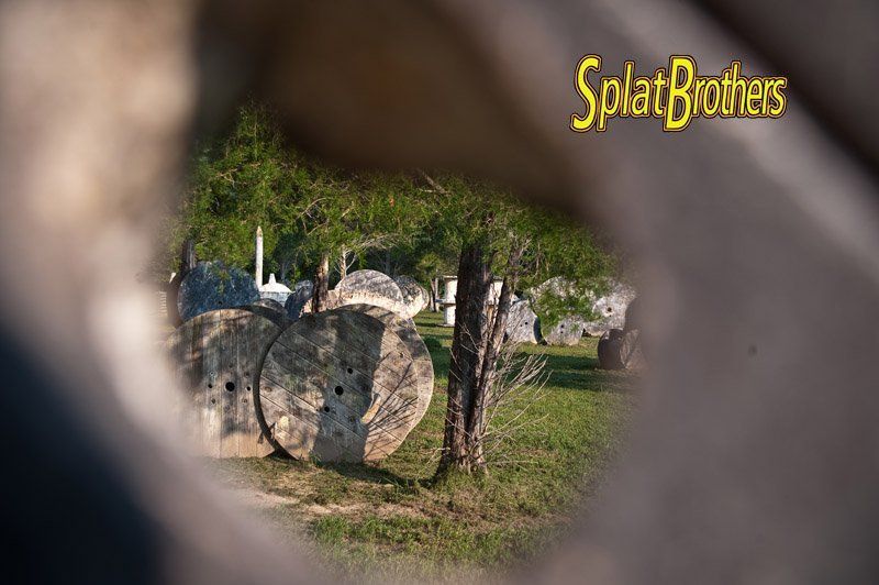 A group of rocks sitting on top of a lush green field.