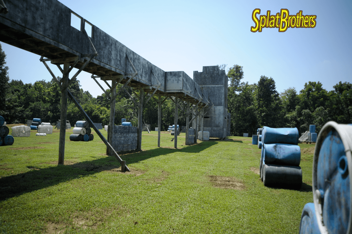 A paintball field with a sign that says spider brothers