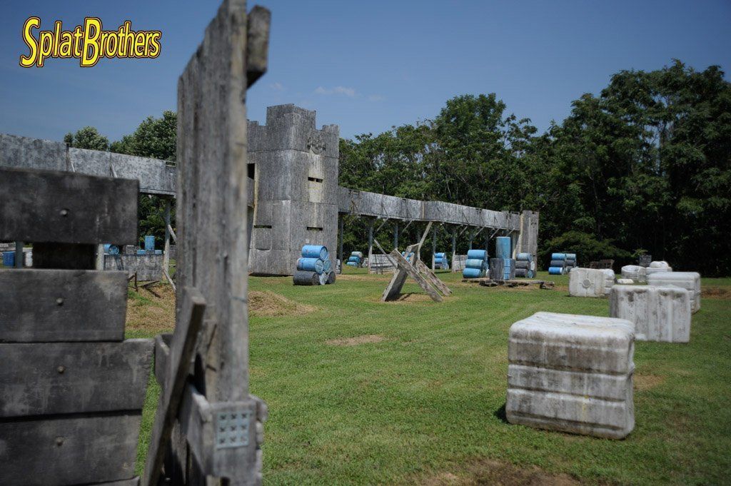 A paintball field with a sign that says splat brothers