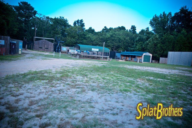 A large grassy field with a sign that says splatbrothers