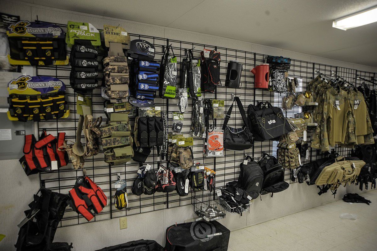 A wall filled with lots of bags and clothes