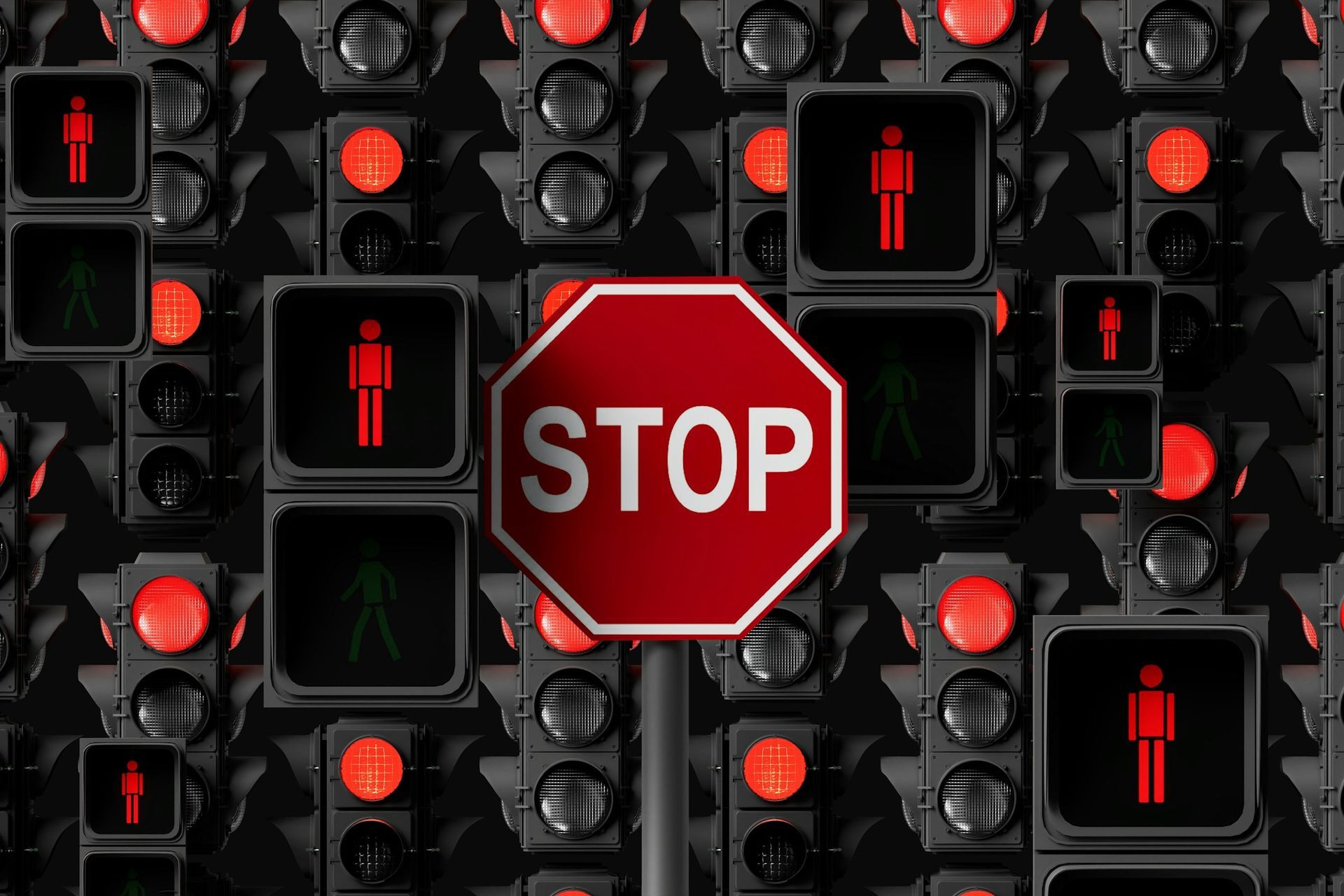 A red stop sign surrounded by traffic lights, symbolizing caution and warning signs