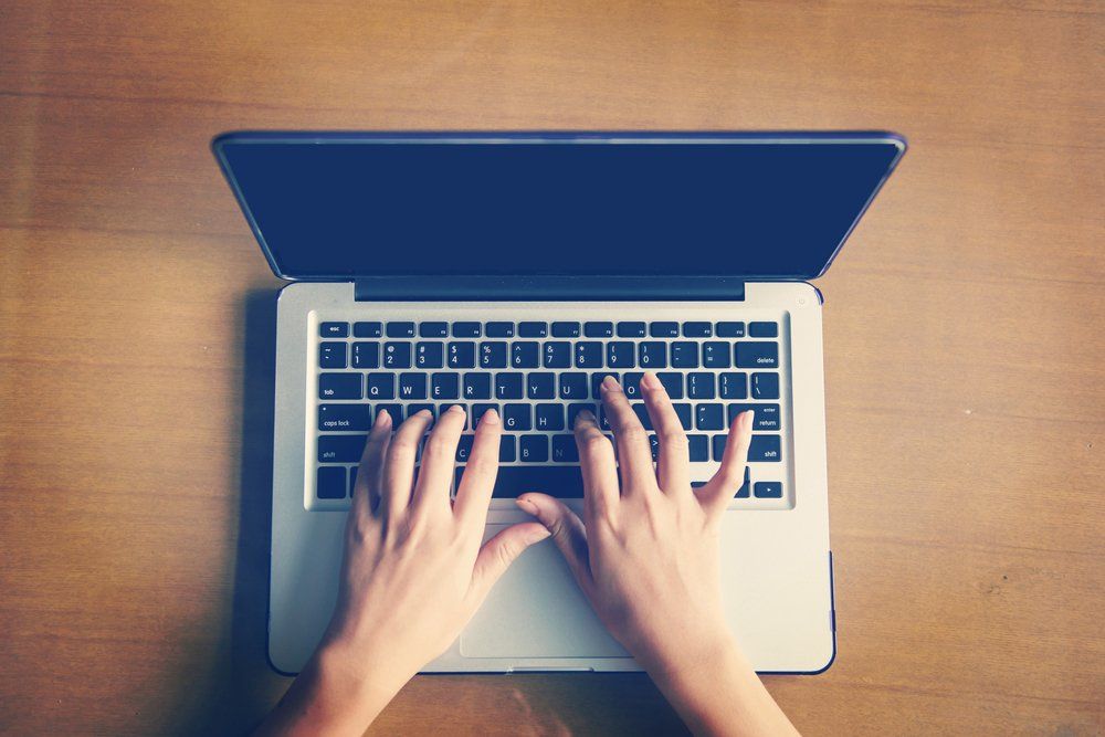 Image Of A Woman Working on Laptop Top View — Providing Business IT Solutions in Ballina, NSW