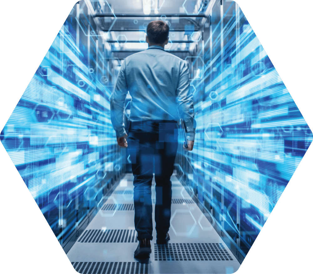 Man walking through server room, surrounded by digital data streams.