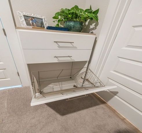 Wooden cupboard with opened drawer