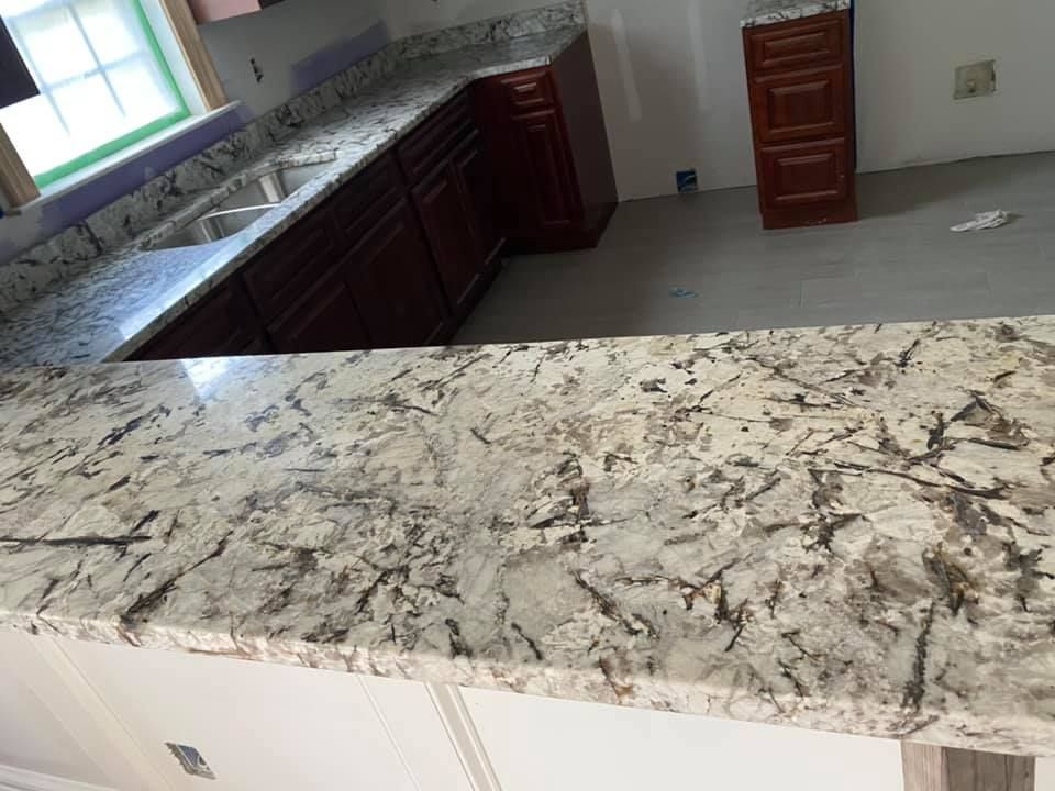 A kitchen with granite counter tops and a sink