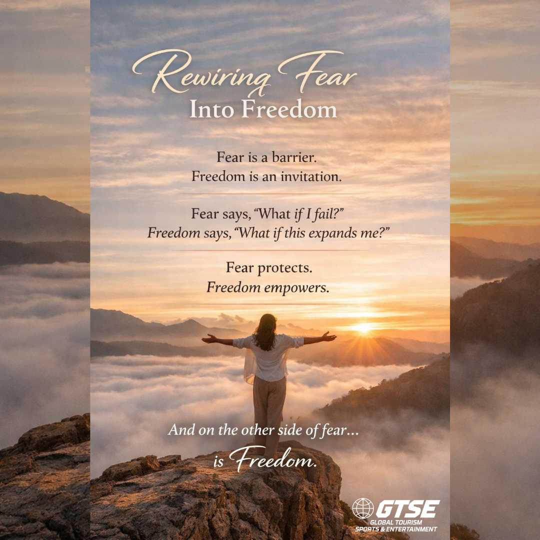 Sunrise over mountains with a person raising arms; text reads Rewiring Fear Into Freedom.