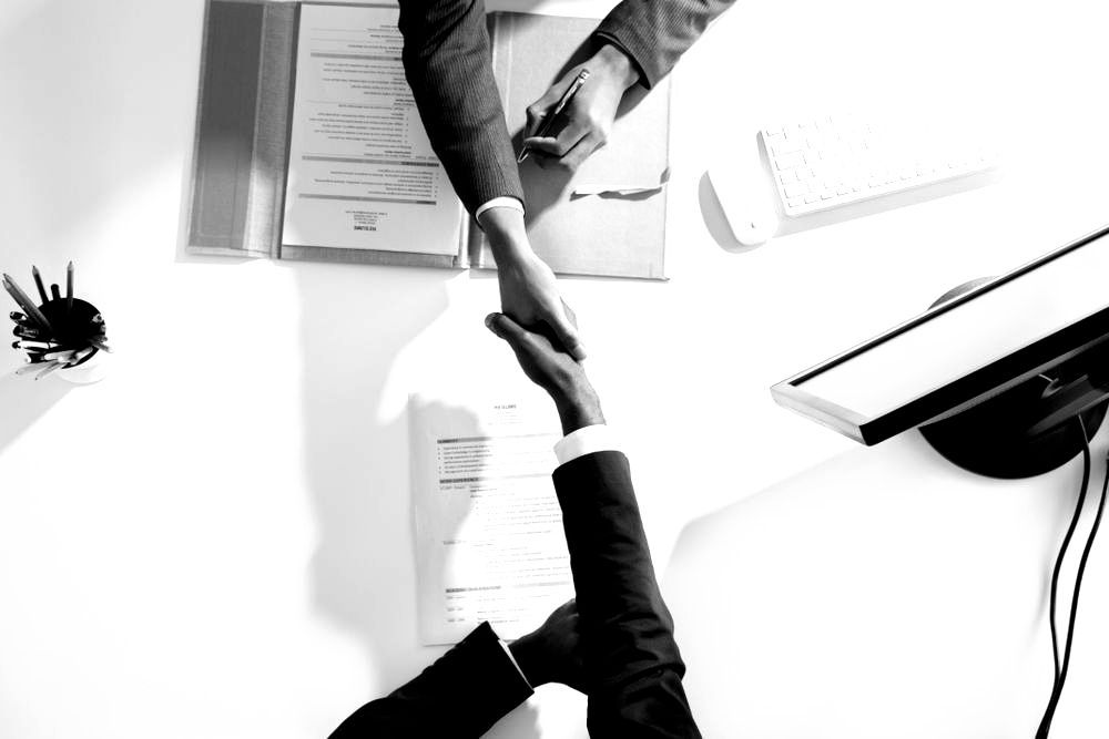man typing on a laptop