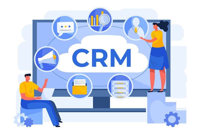 Illustration of CRM software on a laptop with two people and floating icons in blue tones