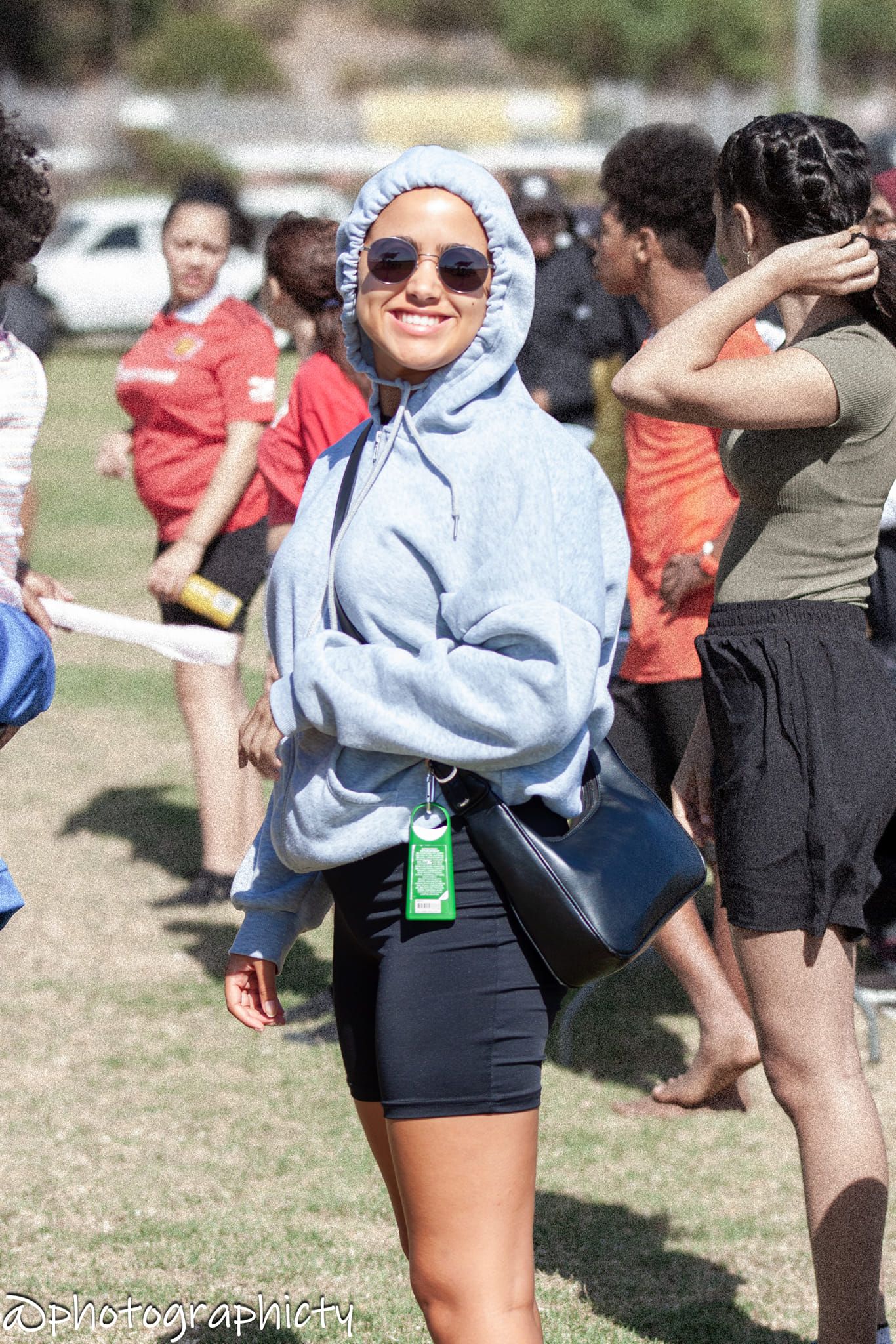 a person is sitting at a table reading a book .
