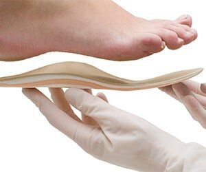 Doctor adapts insole to foot shape — Podiatry treatments in Tampa, FL