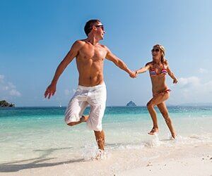 Couple in the beach — Orthopedic in Tampa, FL Couple in the beach — Orthopedic in Tampa, FL