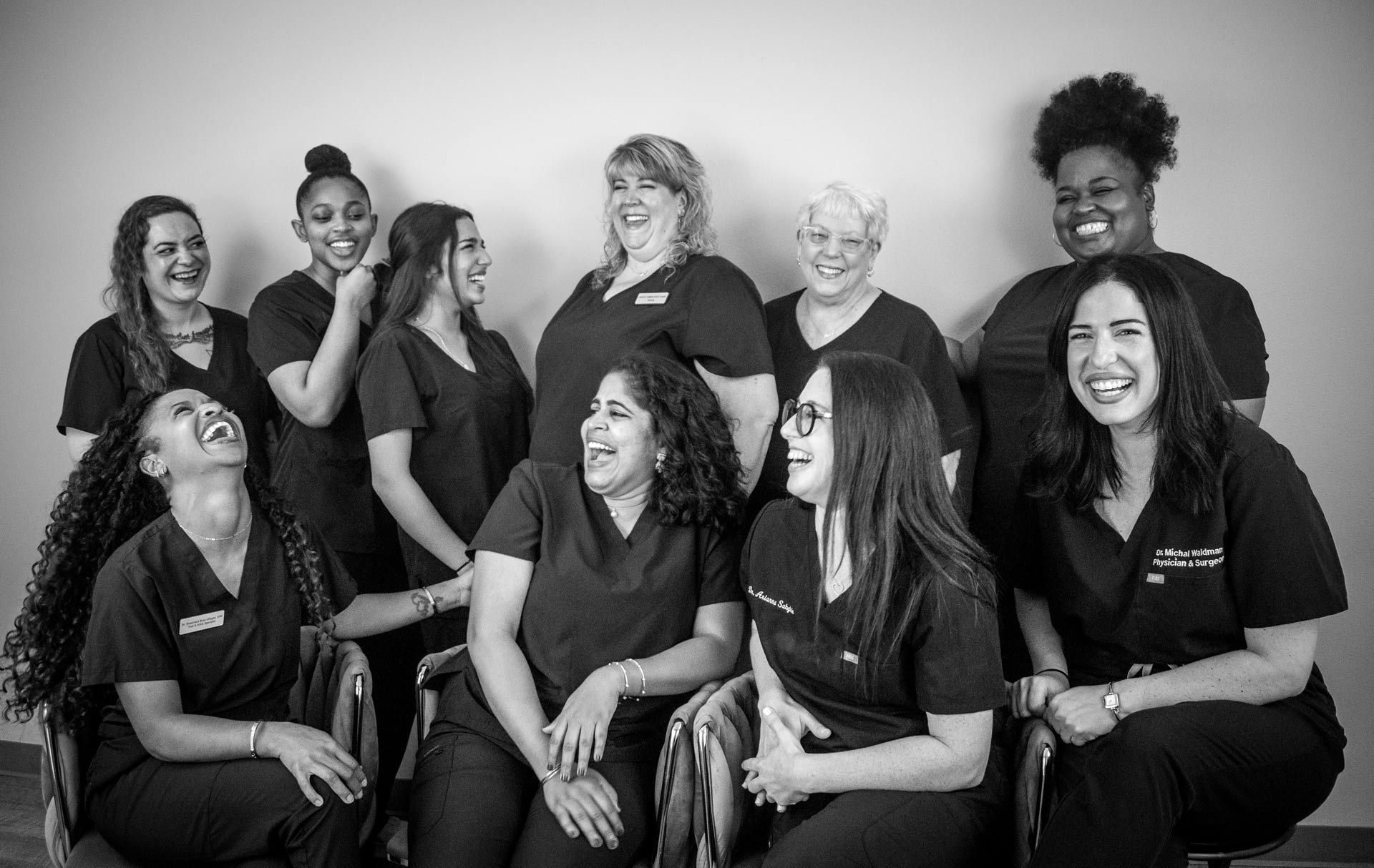 A black and white photo of a group of nurses posing for a picture.