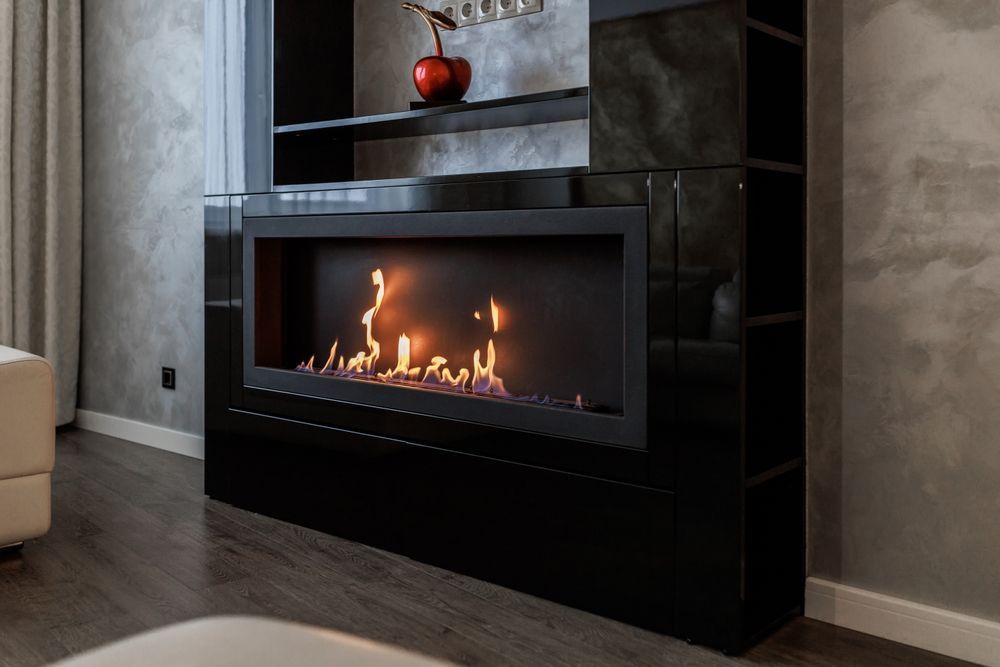 A living room with a fireplace and a couch.