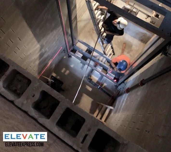 elevator technicians working the shaft