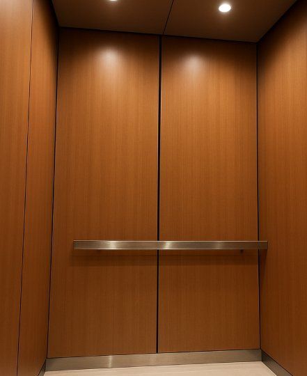 warm wood paneled elevator cab ceiling for refined ambience