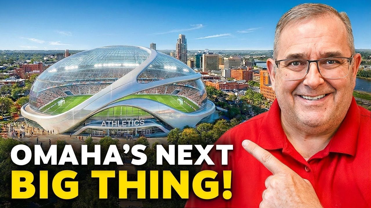 Man in red shirt points at futuristic glass building with bold text, “OMAHA’S NEXT BIG THING!”