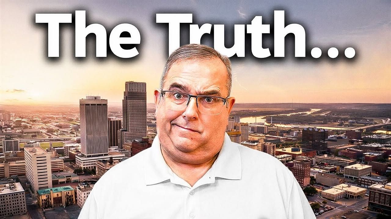 A man with glasses and a skeptical expression stands before a city skyline at sunset under the text