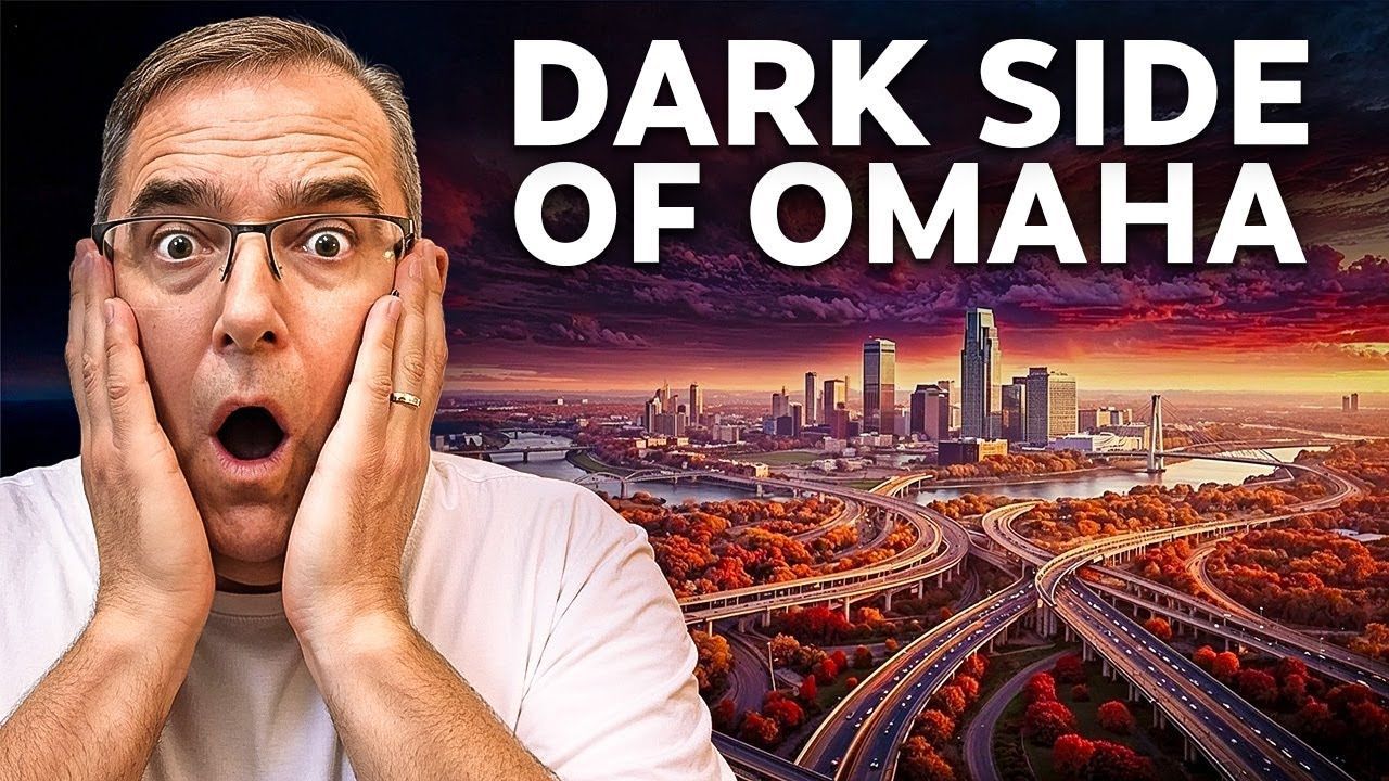 Man with surprised expression, hands on cheeks, in front of Omaha skyline at sunset; video title