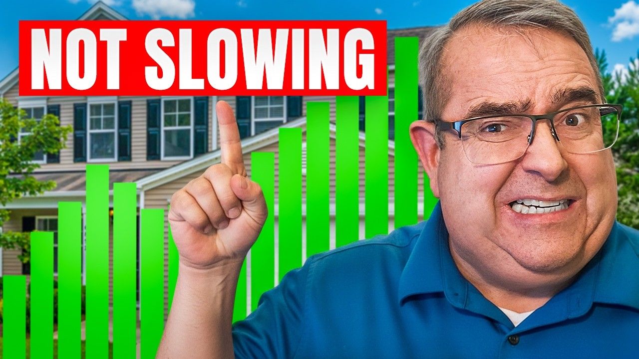 Man pointing upwards near green graph, house in background, 