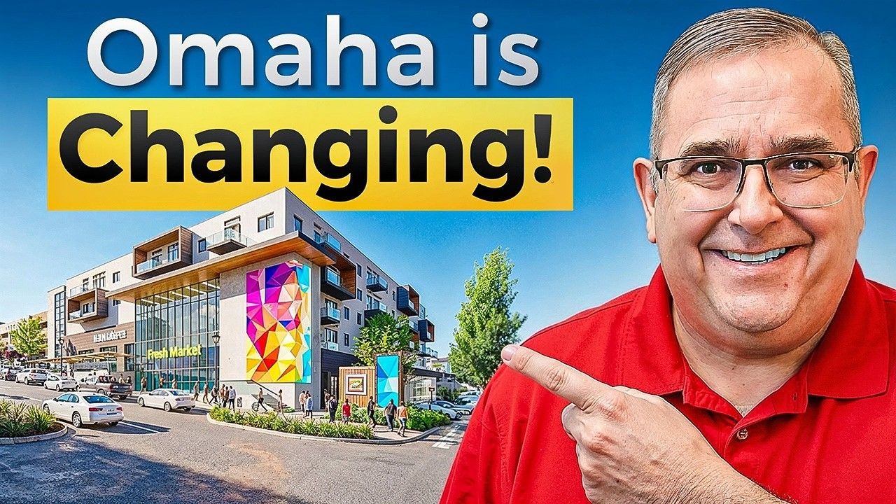 Man in red shirt points to a building with text