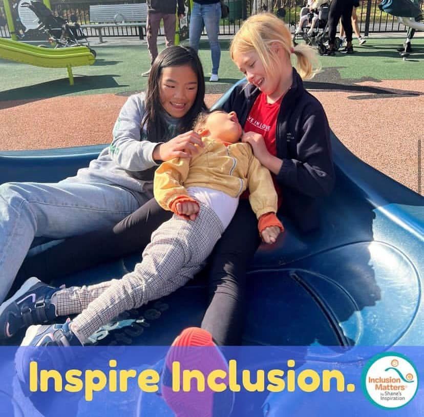 A poster that says inspire inclusion on it