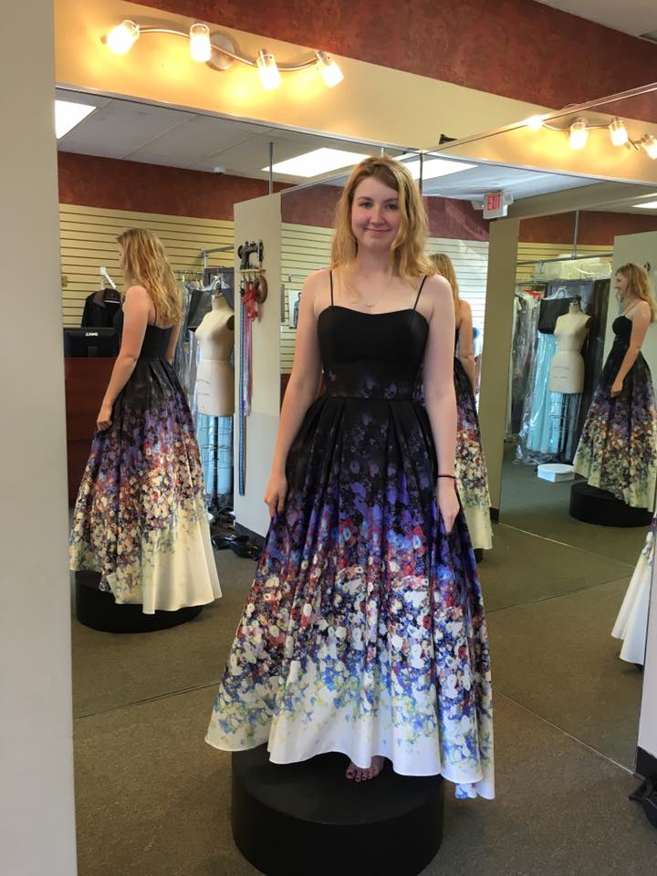 Girl wearing black dress with floral pattern