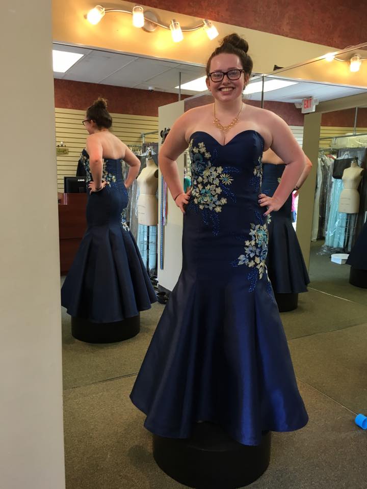 Girl wearing strapless blue prom dress