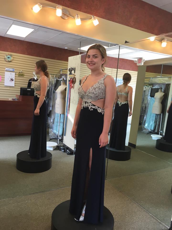 Girl wearing black with side cut  prom dress