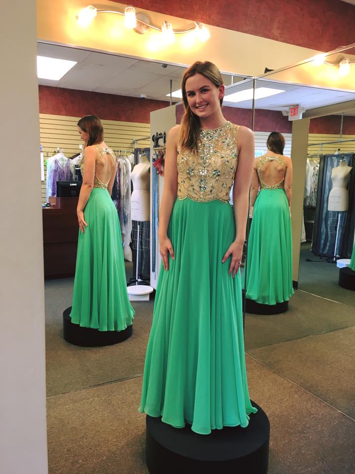 Girl wearing green prom dress