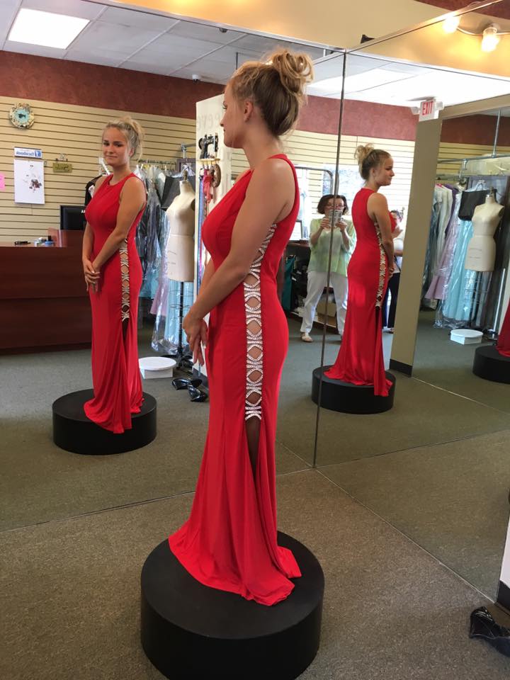 Girl wearing red mermaid side cuts  gown
