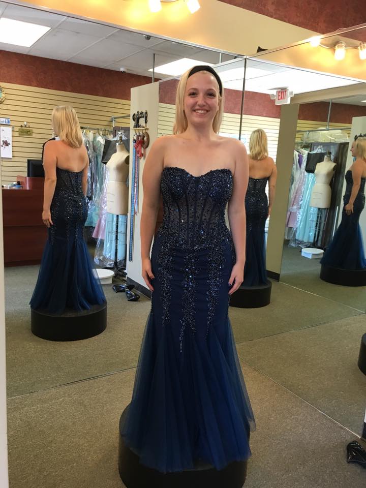 Girl wearing strapless mermaid gown