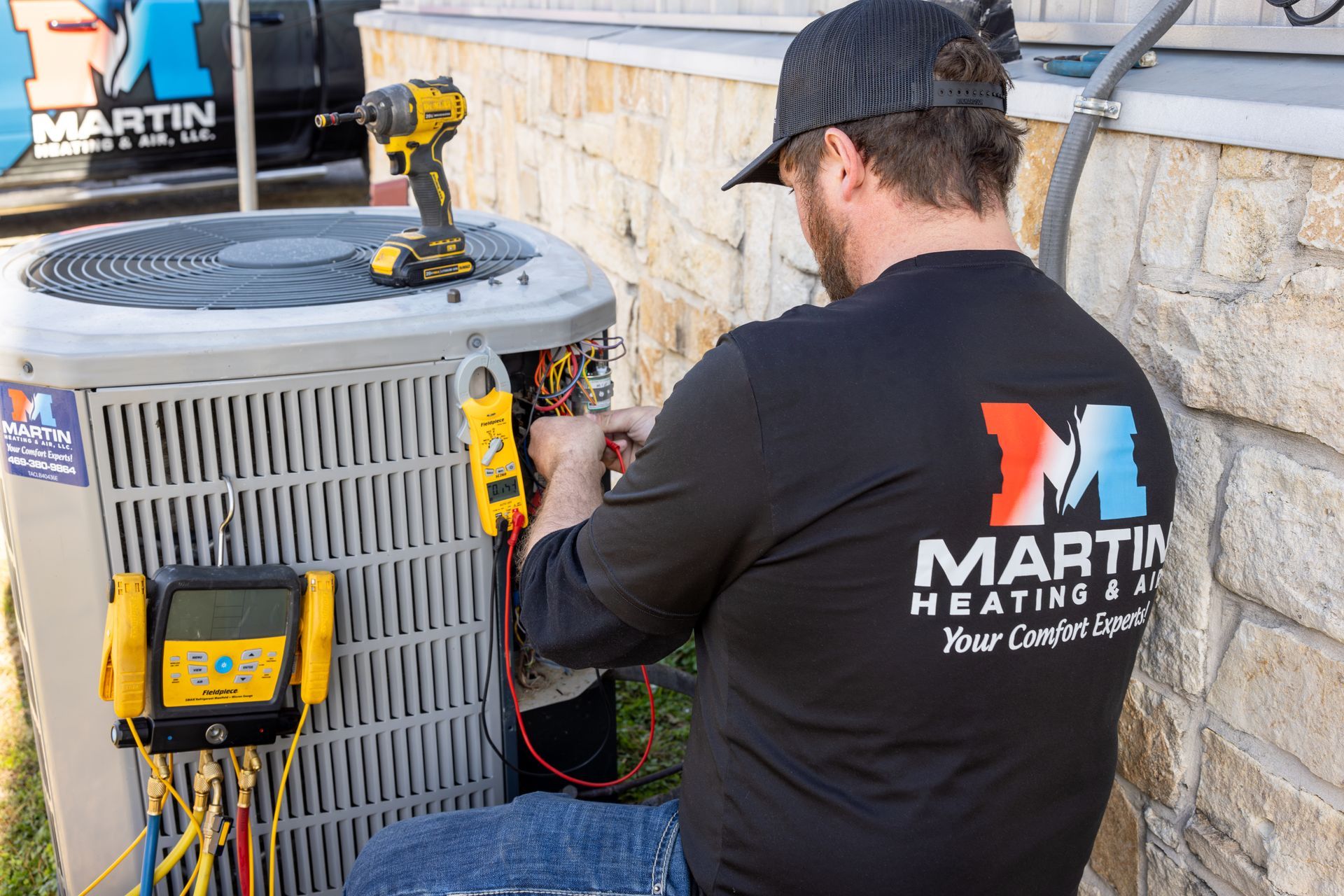 A woman and a little girl are sitting on a couch in a living room.