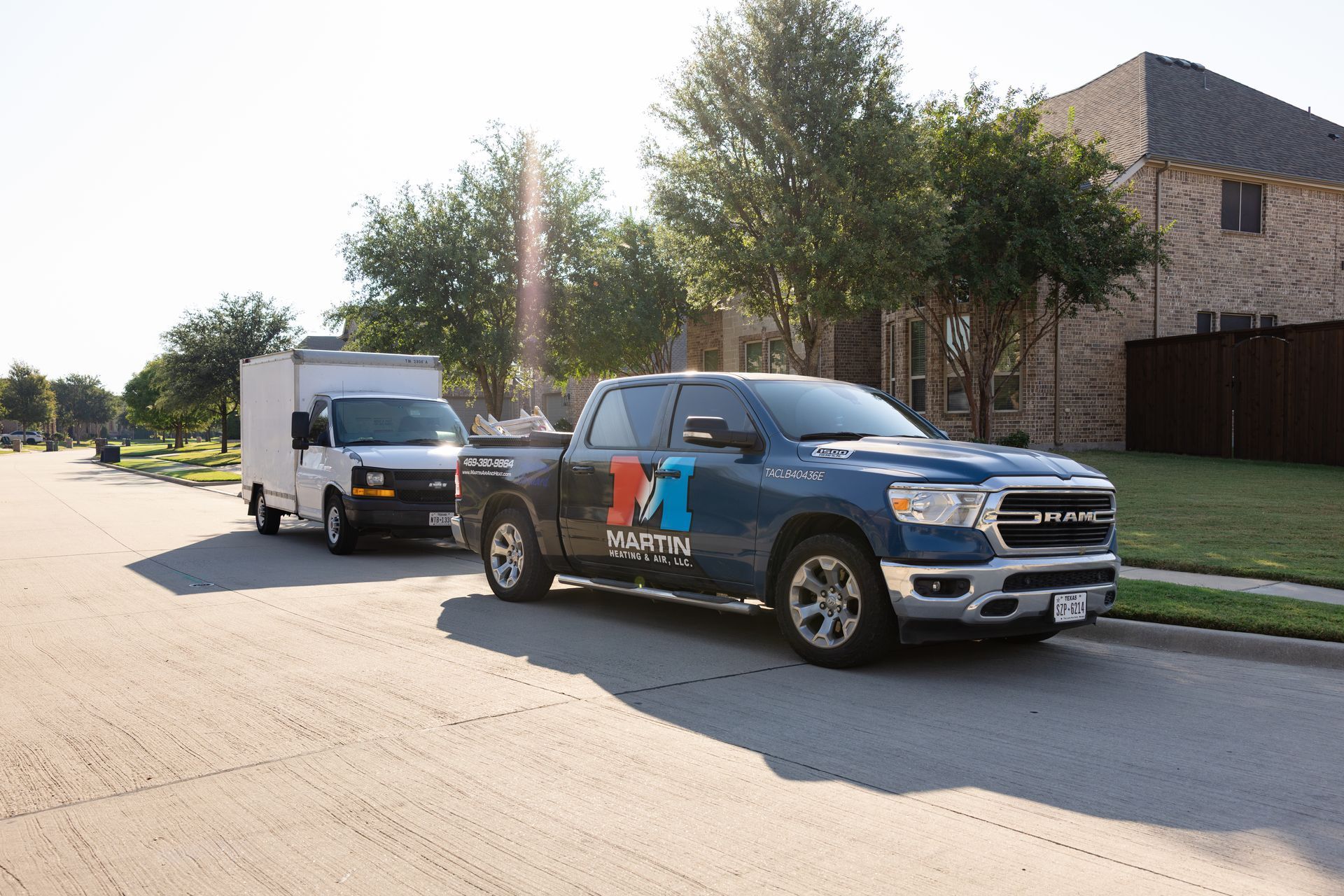 A living room with a couch , table , and plants.