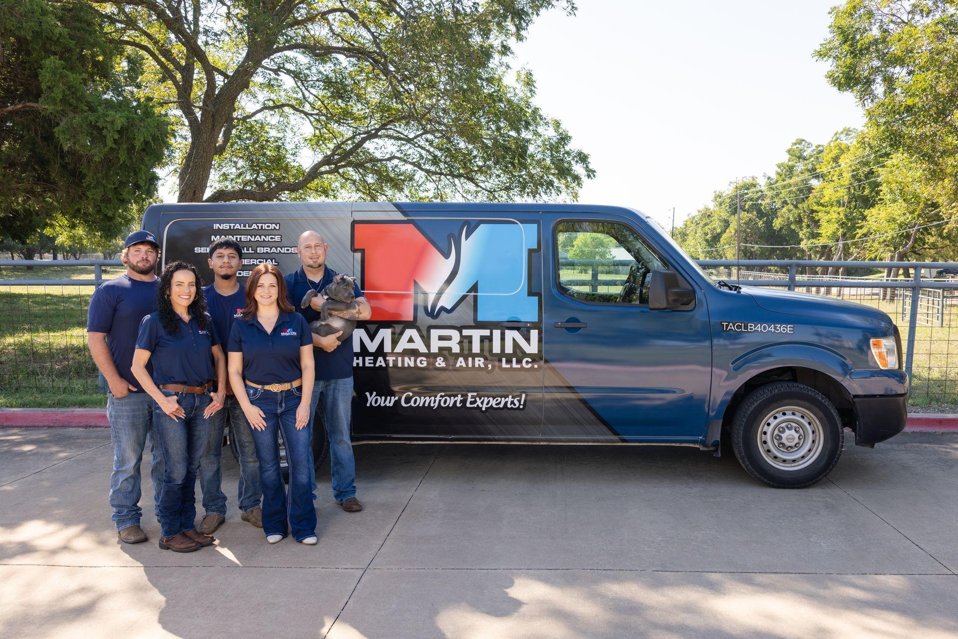 An aerial view of a residential neighborhood with lots of houses and trees.